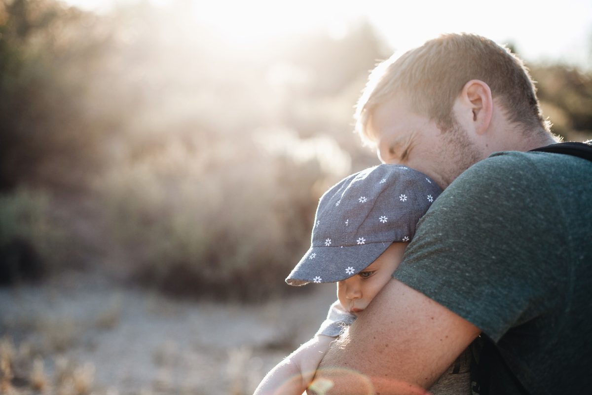 Father carrying child on his shoulder